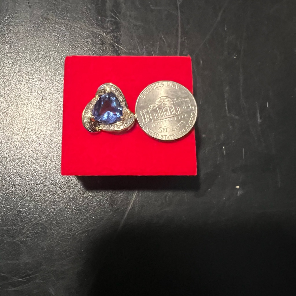 Tanzanite And Diamond Pendant. 10 K Gold